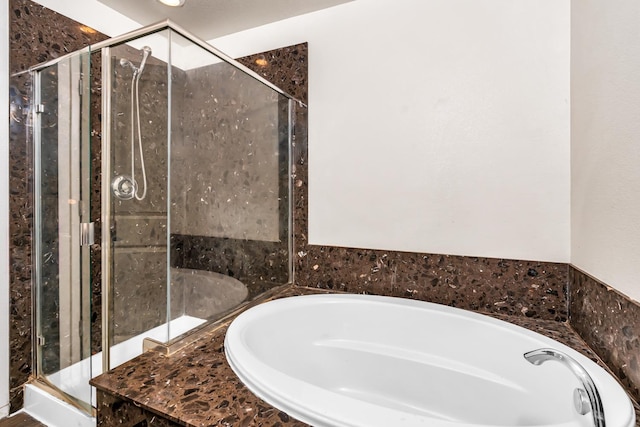 5576 E Burns Ave, Fresno, CA 93727 - bathroom featuring a garden tub and a shower stall