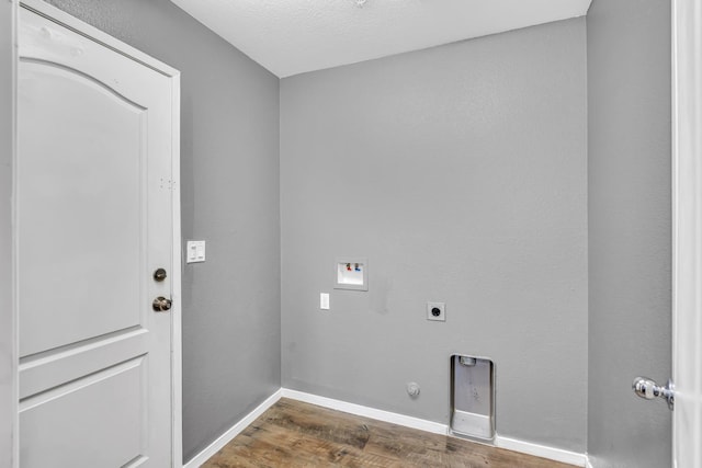 5576 E Burns Ave, Fresno, CA 93727 - laundry area with wood finished floors, hookup for an electric dryer, washer hookup, baseboards, and hookup for a gas dryer