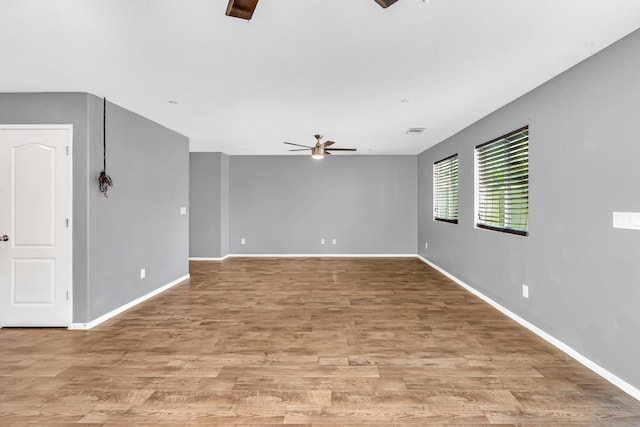 5576 E Burns Ave, Fresno, CA 93727 - spare room featuring ceiling fan, baseboards, and light wood-style floors