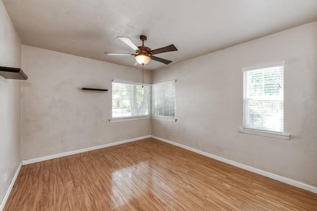 724 W Harvard Ave, Fresno, CA 93705 - empty room with healthy amount of natural light, wood finished floors, ceiling fan, and baseboards