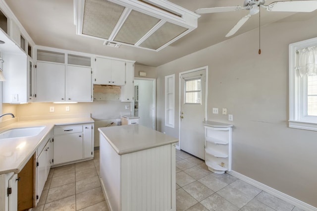 724 W Harvard Ave, Fresno, CA 93705 - kitchen with a sink, plenty of natural light, ceiling fan, and a kitchen island