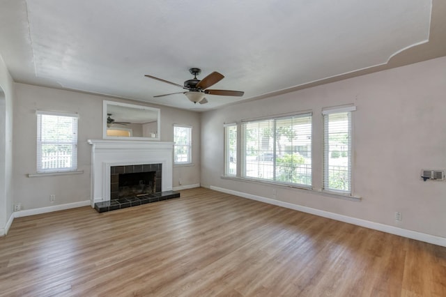 724 W Harvard Ave, Fresno, CA 93705 - unfurnished living room featuring healthy amount of natural light, ceiling fan, and light wood-style floors