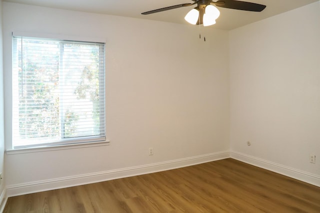 2881 E Huntington Blvd Unit 230, Fresno, CA 93721 - empty room with a ceiling fan, wood finished floors, plenty of natural light, and baseboards