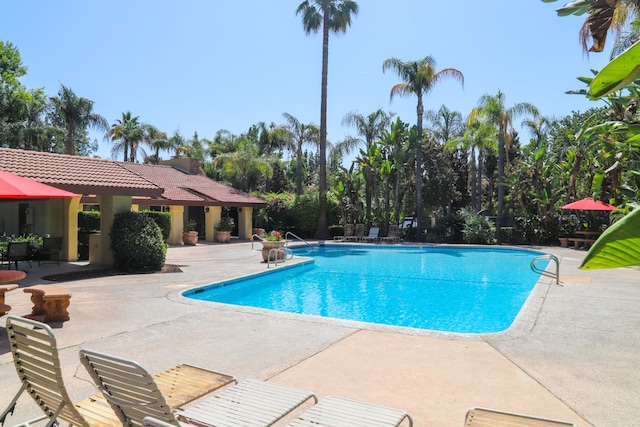 2881 E Huntington Blvd Unit 230, Fresno, CA 93721 - community pool featuring a patio area