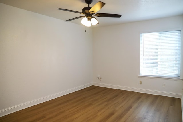 2881 E Huntington Blvd Unit 230, Fresno, CA 93721 - spare room with dark wood-type flooring, plenty of natural light, baseboards, and a ceiling fan