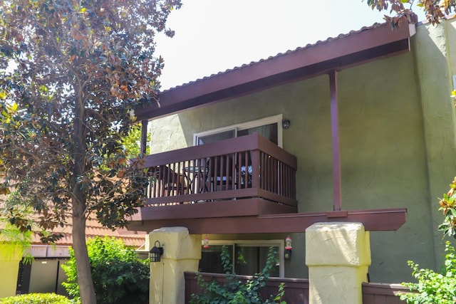 2881 E Huntington Blvd Unit 230, Fresno, CA 93721 - back of property featuring a balcony and stucco siding