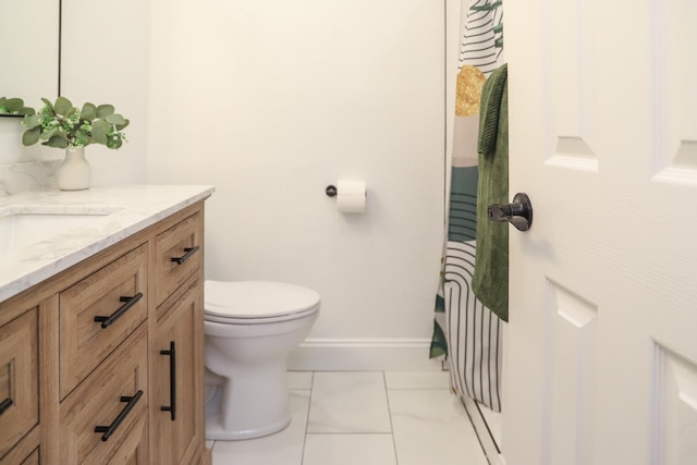2881 E Huntington Blvd Unit 230, Fresno, CA 93721 - bathroom with vanity, toilet, and baseboards