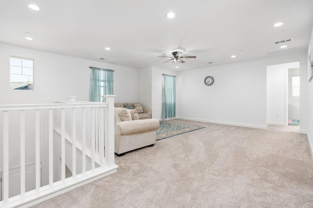 2027 N Bliss Ave, Fresno, CA 93727 - sitting room featuring recessed lighting, ceiling fan, carpet flooring, and an upstairs landing