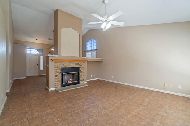 2841 E Brandon Ln, Fresno, CA 93720 - unfurnished living room with a ceiling fan, plenty of natural light, tile patterned floors, a fireplace, and high vaulted ceiling