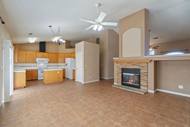 2841 E Brandon Ln, Fresno, CA 93720 - kitchen featuring white appliances, open floor plan, light countertops, a ceiling fan, and a kitchen island