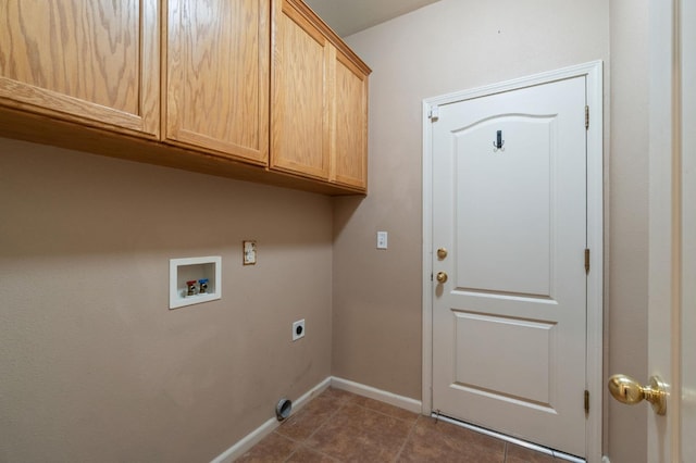 2841 E Brandon Ln, Fresno, CA 93720 - washroom with cabinet space, washer hookup, electric dryer hookup, baseboards, and dark tile patterned flooring