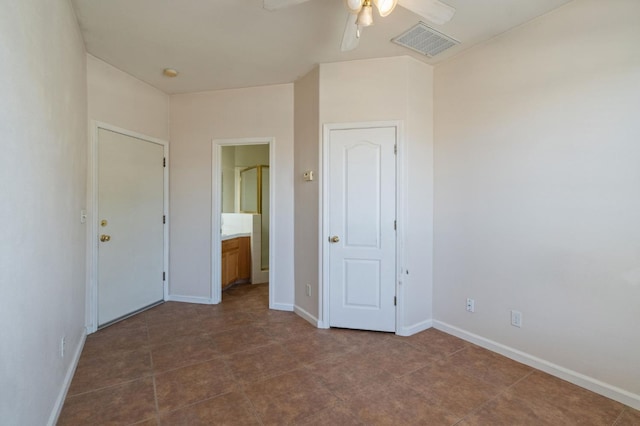 2841 E Brandon Ln, Fresno, CA 93720 - unfurnished bedroom with baseboards, connected bathroom, and a ceiling fan