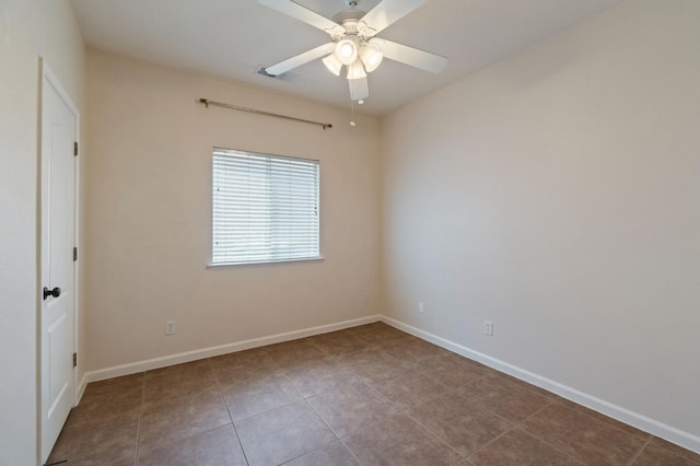 2841 E Brandon Ln, Fresno, CA 93720 - tiled spare room featuring ceiling fan and baseboards