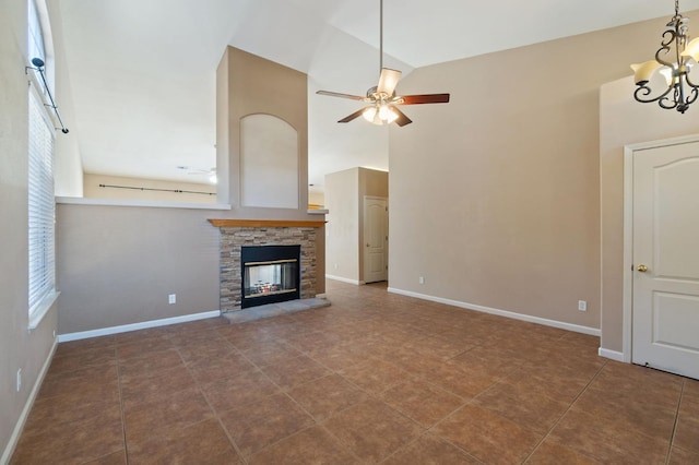 2841 E Brandon Ln, Fresno, CA 93720 - unfurnished living room with high vaulted ceiling, a chandelier, a ceiling fan, a fireplace, and baseboards