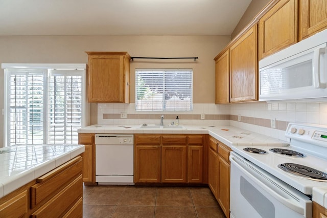 2841 E Brandon Ln, Fresno, CA 93720 - kitchen featuring white appliances, tile countertops, tasteful backsplash, and dark tile patterned flooring