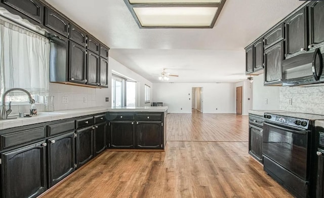 42485 John Muir Dr, Coarsegold, CA 93614 - kitchen featuring black appliances, ceiling fan, tasteful backsplash, and light wood finished floors