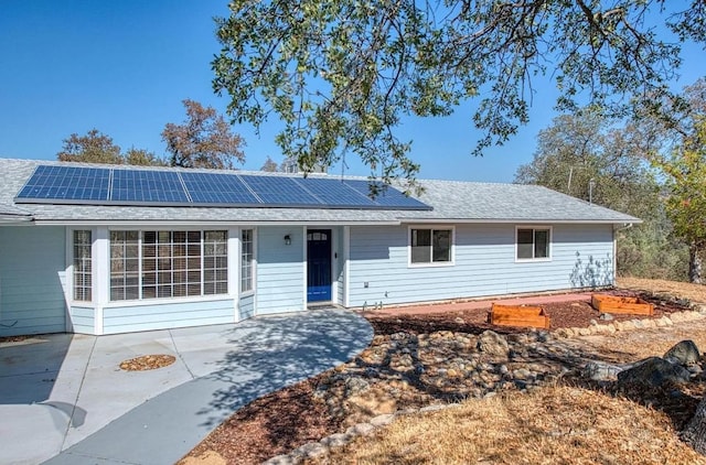42485 John Muir Dr, Coarsegold, CA 93614 - single story home with roof mounted solar panels and roof with shingles