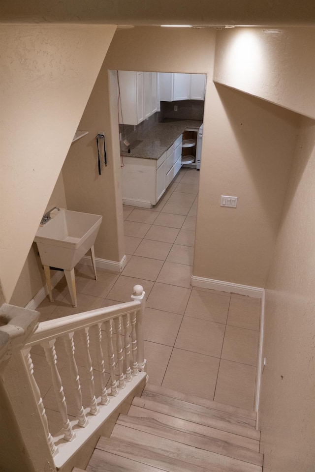 2048 N Arthur Ave, Fresno, CA 93705 - stairway featuring tile patterned flooring and baseboards