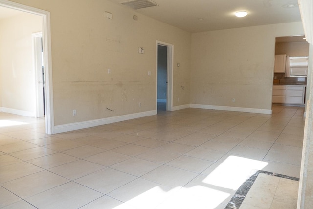 2048 N Arthur Ave, Fresno, CA 93705 - unfurnished room with light tile patterned floors and baseboards