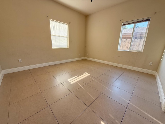 2048 N Arthur Ave, Fresno, CA 93705 - tiled empty room with baseboards