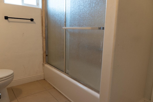 2048 N Arthur Ave, Fresno, CA 93705 - bathroom with toilet, tile patterned flooring, enclosed tub / shower combo, and baseboards