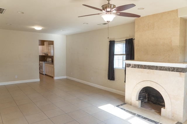 2048 N Arthur Ave, Fresno, CA 93705 - unfurnished living room with ceiling fan, light tile patterned floors, a tiled fireplace, baseboards, and recessed lighting