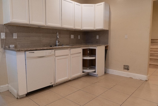 2048 N Arthur Ave, Fresno, CA 93705 - kitchen with white dishwasher, a sink, baseboards, decorative backsplash, and white cabinets