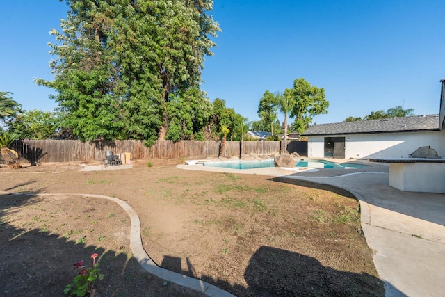 1707 Douglas Ave, Clovis, CA 93611 - fenced backyard with a patio