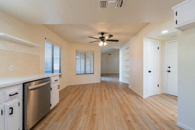 1707 Douglas Ave, Clovis, CA 93611 - kitchen featuring stainless steel dishwasher, light wood-type flooring, white cabinetry, and light countertops