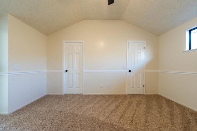 1707 Douglas Ave, Clovis, CA 93611 - unfurnished bedroom featuring carpet flooring, vaulted ceiling, and baseboards