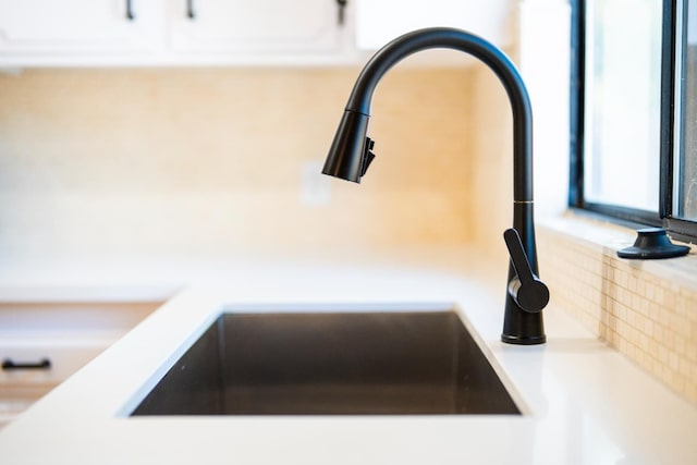 1707 Douglas Ave, Clovis, CA 93611 - kitchen view of a sink, backsplash, and light countertops