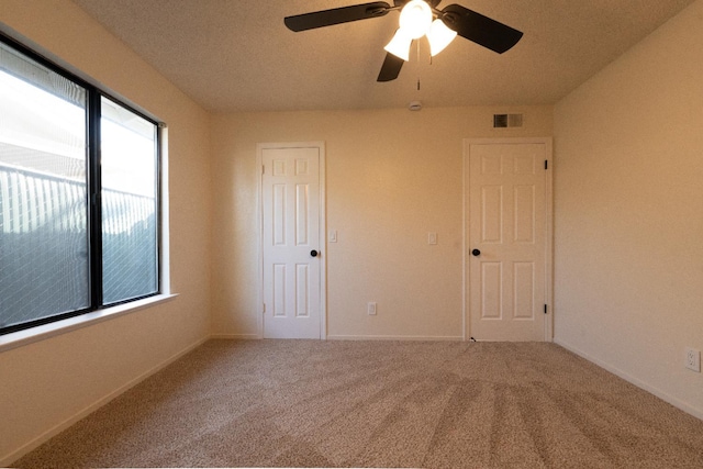 1707 Douglas Ave, Clovis, CA 93611 - unfurnished bedroom with carpet floors, baseboards, and a ceiling fan