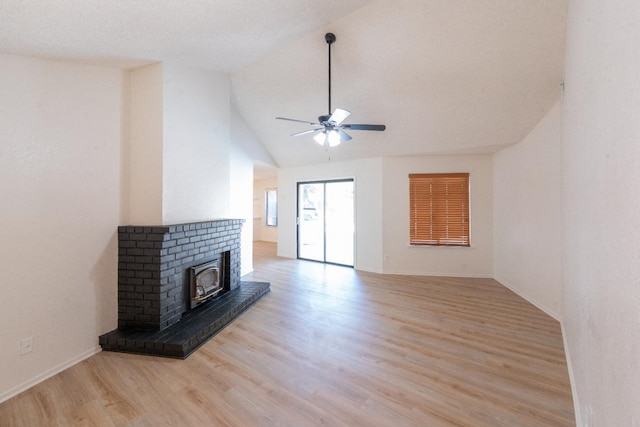 1707 Douglas Ave, Clovis, CA 93611 - unfurnished living room featuring ceiling fan, light wood finished floors, a brick fireplace, baseboards, and high vaulted ceiling