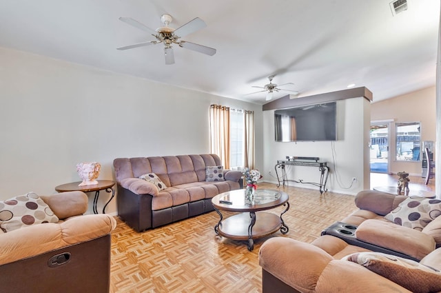 5572 W Indianapolis Ave, Fresno, CA 93722 - living area with a ceiling fan, healthy amount of natural light, lofted ceiling, and baseboards