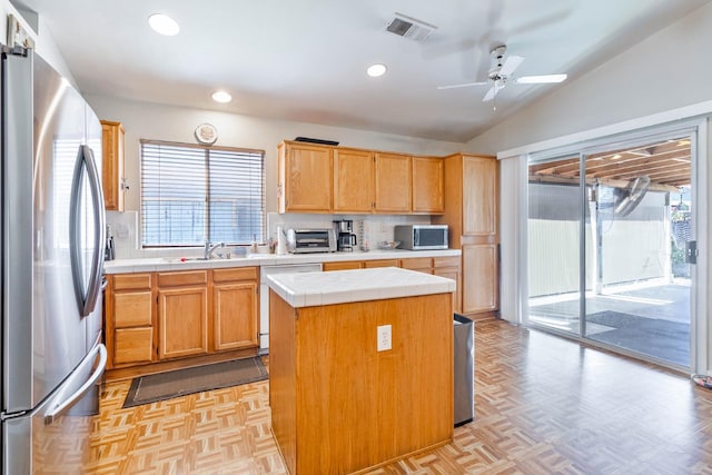 5572 W Indianapolis Ave, Fresno, CA 93722 - kitchen featuring stainless steel appliances, tile counters, a kitchen island, recessed lighting, and ceiling fan