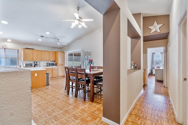 5572 W Indianapolis Ave, Fresno, CA 93722 - kitchen with light brown cabinetry, a ceiling fan, lofted ceiling, baseboards, and recessed lighting