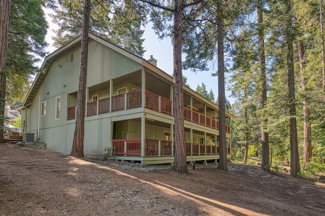 41228 Heartwood Ln, Shaver Lake, CA 93664 - rear view of house with a chimney and a balcony
