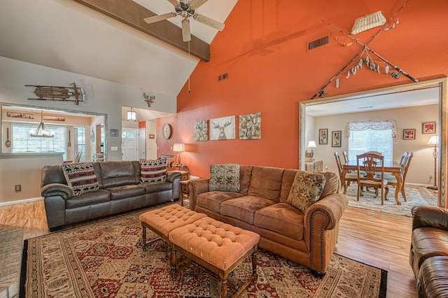 41228 Heartwood Ln, Shaver Lake, CA 93664 - living room with wood finished floors, a ceiling fan, beamed ceiling, high vaulted ceiling, and baseboards