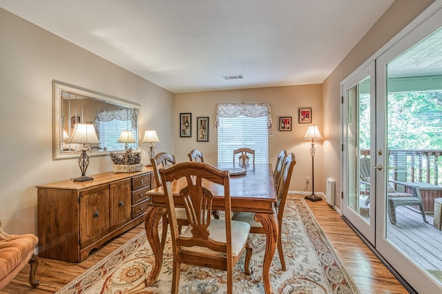 41228 Heartwood Ln, Shaver Lake, CA 93664 - dining room with light wood-style flooring, french doors, and baseboards