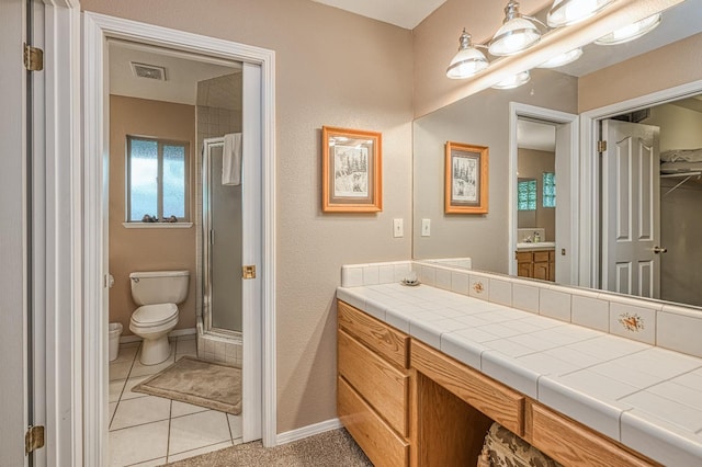 41228 Heartwood Ln, Shaver Lake, CA 93664 - bathroom featuring toilet, a shower stall, vanity, baseboards, and tile patterned floors