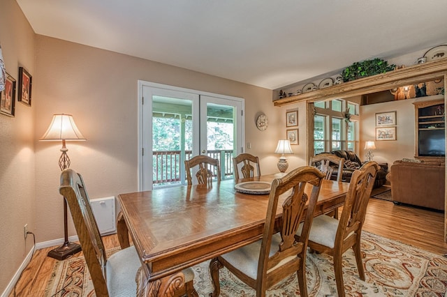 41228 Heartwood Ln, Shaver Lake, CA 93664 - dining room featuring french doors, light wood-type flooring, and baseboards