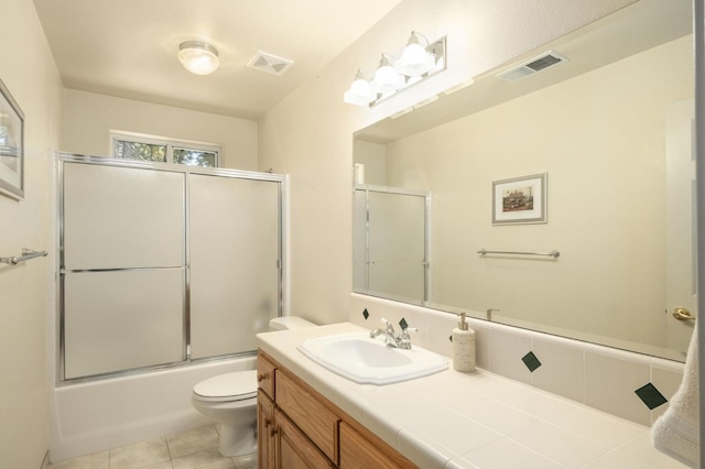 41035 Cold Springs Ln, Shaver Lake, CA 93664 - full bathroom featuring vanity, toilet, tile patterned flooring, and combined bath / shower with glass door