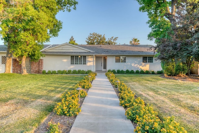 1463 W San Madele Ave, Fresno, CA 93711 - ranch-style house with stucco siding and a front lawn