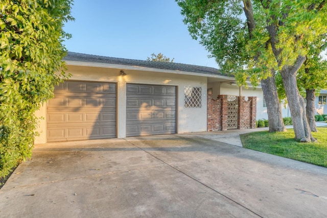 1463 W San Madele Ave, Fresno, CA 93711 - single story home with concrete driveway, stucco siding, a garage, and brick siding