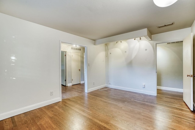 1463 W San Madele Ave, Fresno, CA 93711 - spare room with light wood-style flooring and baseboards