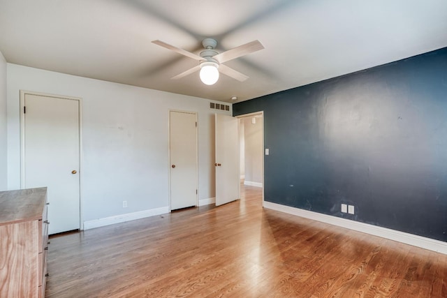 1463 W San Madele Ave, Fresno, CA 93711 - unfurnished bedroom featuring light wood finished floors, baseboards, and a ceiling fan