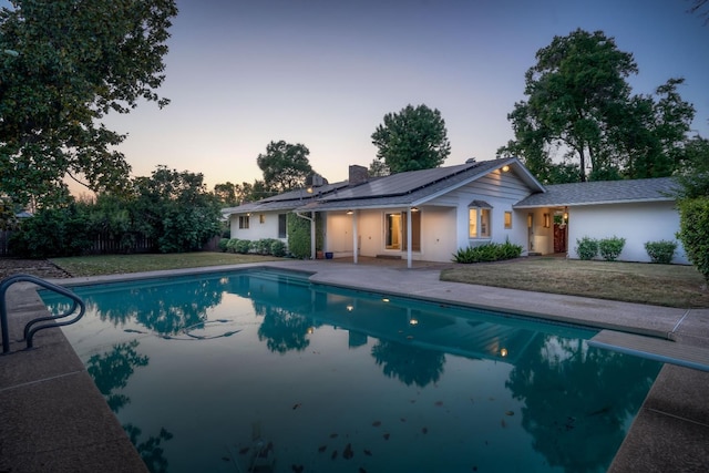 1463 W San Madele Ave, Fresno, CA 93711 - pool at dusk with an outdoor pool, a patio area, and a diving board