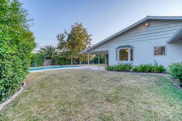 1463 W San Madele Ave, Fresno, CA 93711 - view of grassy yard with a patio and a carport