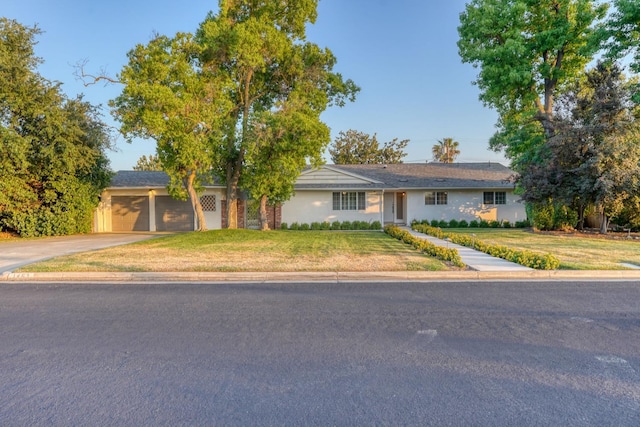 1463 W San Madele Ave, Fresno, CA 93711 - single story home featuring a garage, a front yard, and driveway
