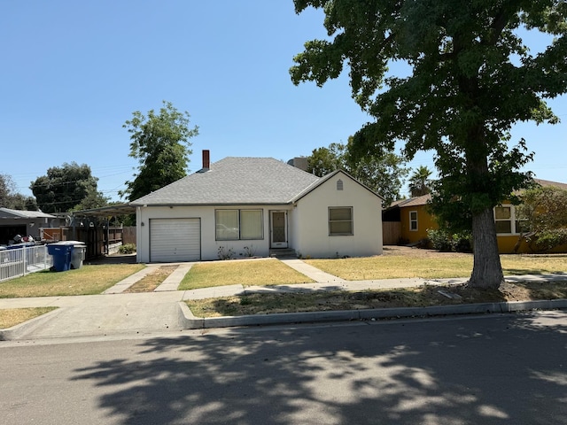 2314 E Cornell Ave, Fresno, CA 93703 - single story home featuring an attached garage, driveway, a front lawn, stucco siding, and roof with shingles
